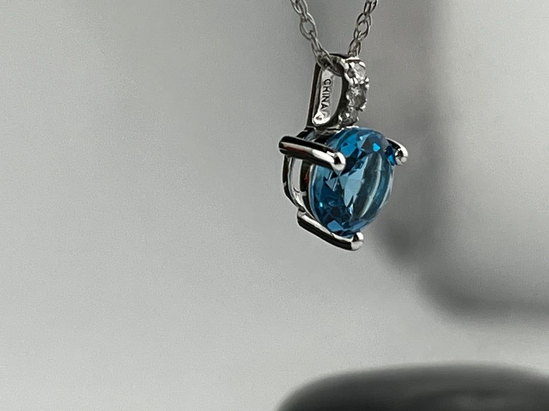 10K White Gold Blue Topaz and Diamond Necklace
