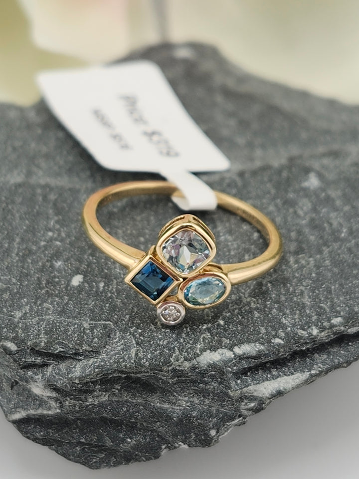 10K Gold Diamond and Blue Topaz Ring