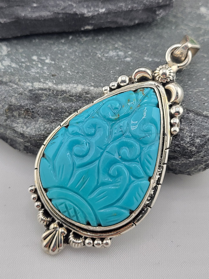 Carved Turquoise Pendant